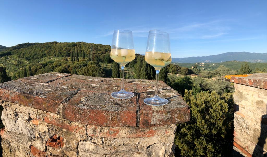 2 glasses of chilled Barbì wine on the tower crenellation