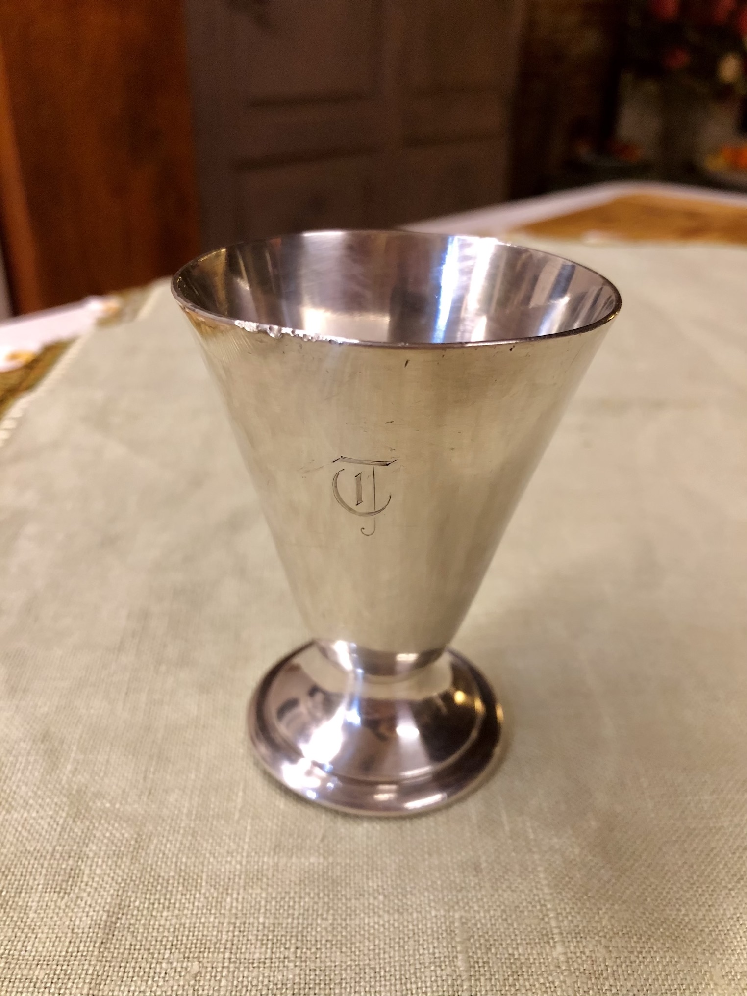 Silver cup with TC initials engraved