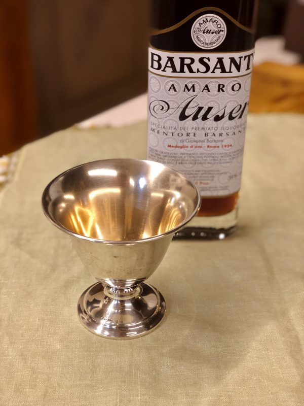 Large silver cup and amaro bottle